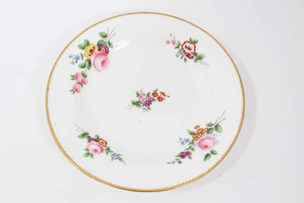 Lot 15 - Nantgarw plate, circa 1817-20, polychrome painted with flowers with gilt rim, impressed mark to base, 21cm diameter