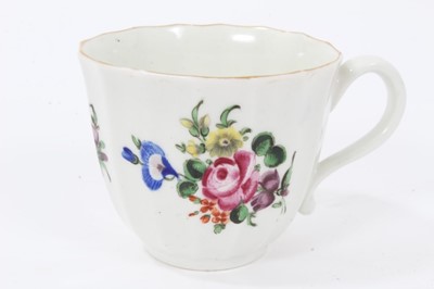 Lot 17 - Worcester faceted coffee cup and saucer, circa 1770, polychrome painted with flowers