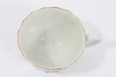 Lot 17 - Worcester faceted coffee cup and saucer, circa 1770, polychrome painted with flowers