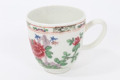 Lot 19 - Bow coffee cup, circa 1752, decorated in the famille rose style with flowers and a patterned border, 5.75cm high