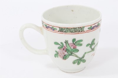 Lot 19 - Bow coffee cup, circa 1752, decorated in the famille rose style with flowers and a patterned border, 5.75cm high
