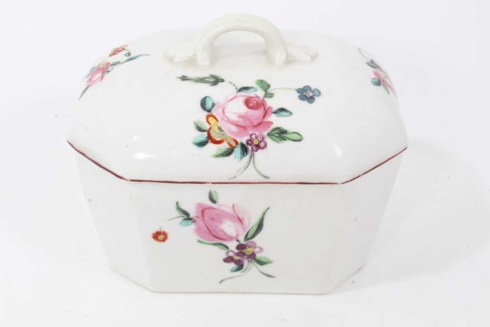 Lot 23 - Derby canted rectangular butter tub and cover, circa 1760-65, polychrome painted with floral sprays, with red-painted rims, 12cm across