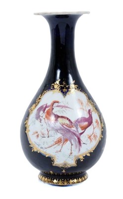 Lot 25 - Chelsea bottle vase, circa 1760, decorated with exotic birds on a cobalt blue and gilt-patterned ground, gilt anchor mark to base, 21cm high