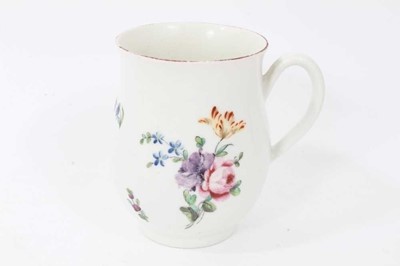 Lot 227 - Derby baluster shaped mug, circa 1760, polychrome painted with floral sprays, red painted rim, 10cm high