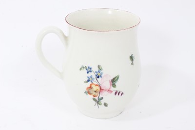 Lot 32 - Derby baluster shaped mug, circa 1760, polychrome painted with floral sprays, red painted rim, 10cm high