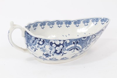 Lot 46 - Worcester sauceboat, circa 1770, painted in underglaze blue with the Doughnut Tree pattern, 18cm long