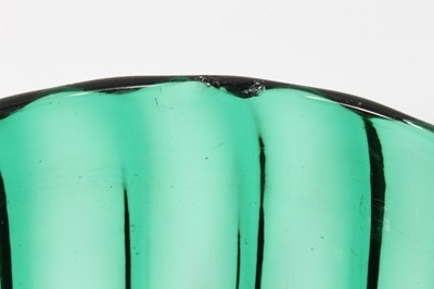 Lot 65 - Pair of green glass finger bowls, early 19th century, of moulded round shape with polished pontil marks, 9cm high