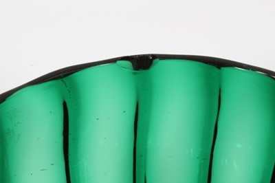 Lot 65 - Pair of green glass finger bowls, early 19th century, of moulded round shape with polished pontil marks, 9cm high
