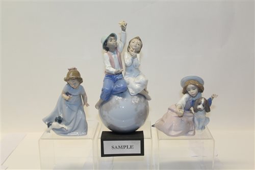 Lot 1060 - Two Lladro porcelain figures - boy and girl...