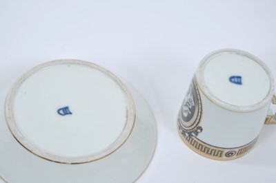 Lot 69 - Vienna coffee can and saucer, circa 1780, painted en grisaille with a portrait in profile, the edge with fret pattern, highlighted in gilt, underglaze blue marks to bases, the saucer measuring 13.5...