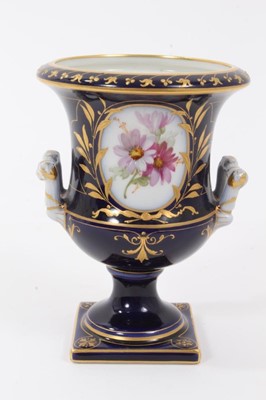 Lot 249 - Small Berlin porcelain campana vase, circa 1880, painted with flowers on a gilt and cobalt blue ground, marks to base, 9.75cm high