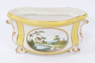 Lot 72 - Derby yellow-ground bough pot, circa 1790-1800, polychrome painted with landscape scenes, with scrolling handles and feet, 18.5cm wide