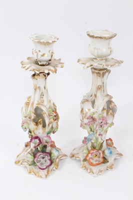 Lot 75 - Pair of Paris flower-encrusted candlesticks, circa 1860, with gilt scrollwork stems, 25cm tall