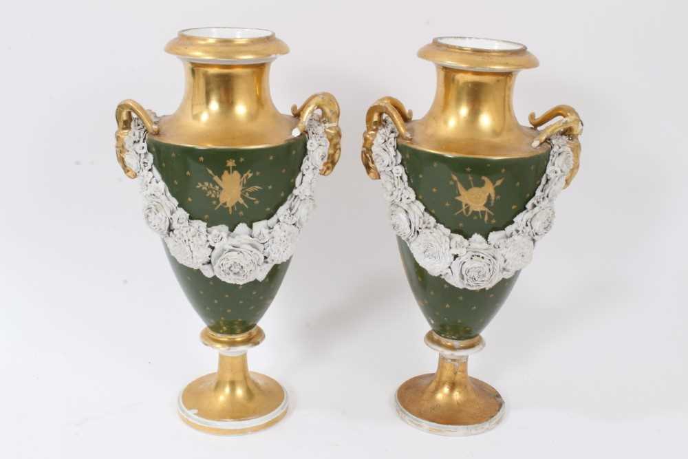 Lot 46 - Pair of Paris porcelain vases, 19th century, decorated with swags of encrusted flowers on a green and gilt ground, 29cm high
