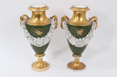Lot 76 - Pair of Paris porcelain vases, 19th century, decorated with swags of encrusted flowers on a green and gilt ground, 29cm high