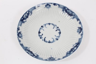 Lot 81 - Worcester blue and white fluted tea bowl and saucer, circa 1760, decorated with patterned borders, the saucer measuring 11.75cm diameter