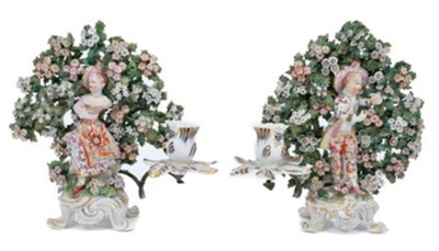 Lot 233 - Pair of Bow 'New Dancer' figure candlesticks, circa 1765, with bocage decoration behind each figure, standing on scrollwork bases, 24cm high