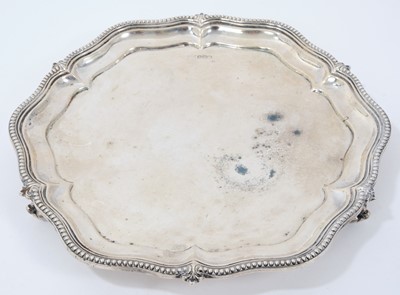 Lot 331 - 1930s silver salver of hexagonal form, with bead and fleur de lys border