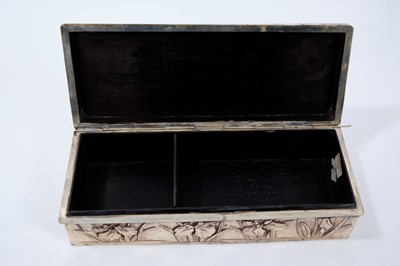 Lot 335 - Late 19th/early 20th century Japanese silver box of rectangular form, with Iris floral decoration