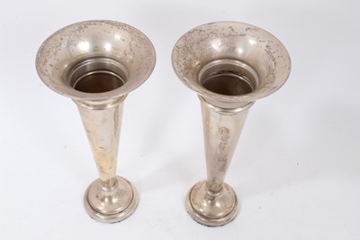 Lot 337 - Pair early George V silver trumpet vases of inverted conical form on circular pedestal bases