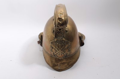 Lot 740 - Edwardian Brass Merryweather Fireman's helmet with brass chin chains, leather lining and label for Merryweather & Sons, Firemen's outfitters London.
