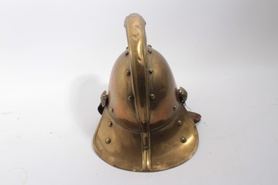 Lot 740 - Edwardian Brass Merryweather Fireman's helmet with brass chin chains, leather lining and label for Merryweather & Sons, Firemen's outfitters London.