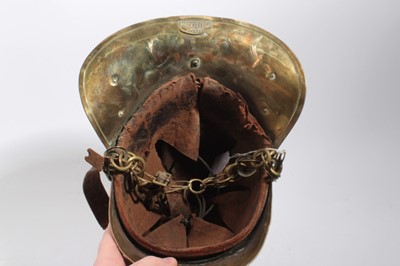 Lot 740 - Edwardian Brass Merryweather Fireman's helmet with brass chin chains, leather lining and label for Merryweather & Sons, Firemen's outfitters London.