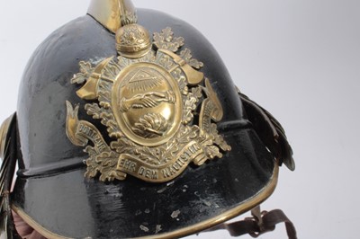 Lot 741 - 1920's German steel Fireman's helmet in black painted finish with brass comb, badge and chin strap, with leather head band.