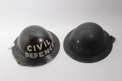 Lot 742 - Second World War British Military MKII Steel Helmet with painted finish and Civil Defence naming, together with another similar Police Steel helmet (2)