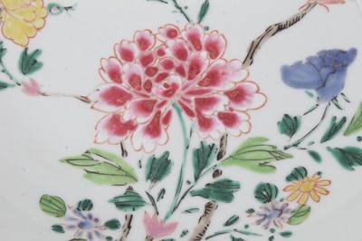 Lot 98 - Chinese famille rose saucer dish, Qianlong period, decorated with an exotic bird perfected on a branch, surrounded by various flowers, 21.75cm diameter