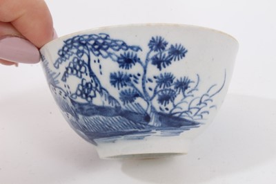 Lot 104 - Lowestoft blue and white tea bowl, and a Bow blue and white tea bowl, both decorated in the Chinese style (2)
