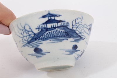 Lot 104 - Lowestoft blue and white tea bowl, and a Bow blue and white tea bowl, both decorated in the Chinese style (2)