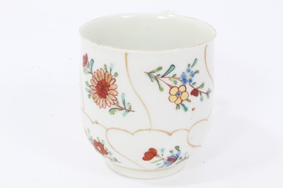 Lot 105 - Worcester coffee cup, circa 1770, painted with flowers with wavy gilt borders, 5.75cm high