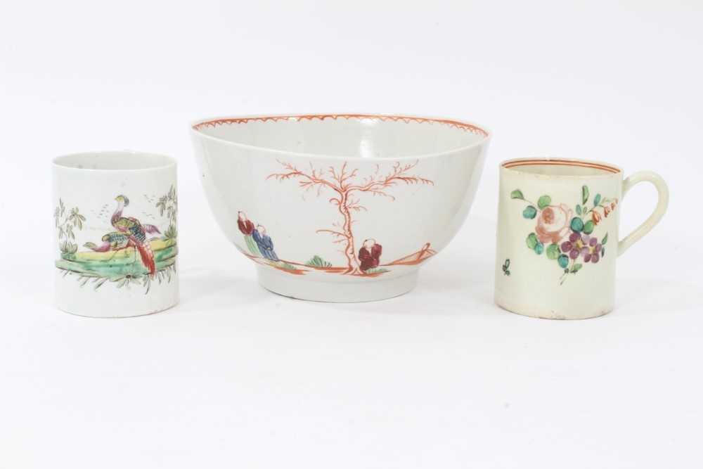 Lot 106 - Liverpool bowl, circa 1780, polychrome decorated with Chinese figures, together with two Liverpool coffee cans, one with birds, the other with flowers (3)