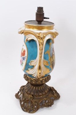 Lot 110 - Good Sèvres style porcelain lamp, standing on an ormolu base, the lamp decorated with figural scenes on a blue and gilt ground, total height 44cm
