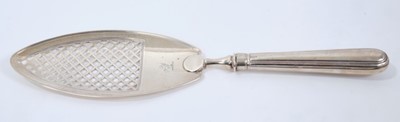 Lot 383 - George III silver fish slice with pierced latticework blade and engraved armorial crest