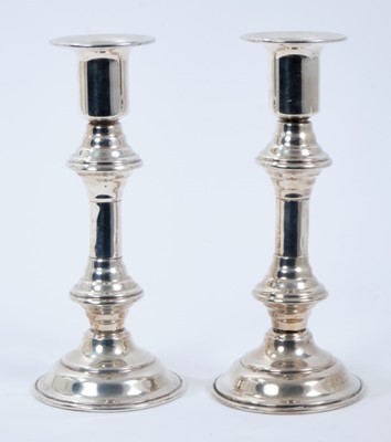 Lot 386 - Pair Mexican silver candlesticks with knopped stems on circular domed bases