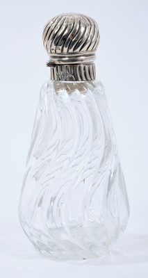Lot 387 - Victorian wrythen pattern cut glass toilet bottle of conical form with silver hinged cover