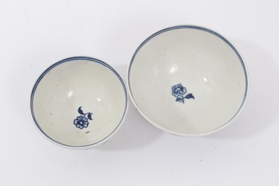 Lot 182 - A Worcester Fence pattern stand for a butter tub, two blue printed tea bowls and a saucer (the saucer with rare 'Man in the Moon' mark)