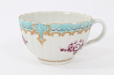 Lot 185 - A Worcester coffee cup, a tea cup, a tea bowl in the Hibiscus pattern, and two Royal Lily pattern large saucers
