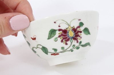 Lot 185 - A Worcester coffee cup, a tea cup, a tea bowl in the Hibiscus pattern, and two Royal Lily pattern large saucers