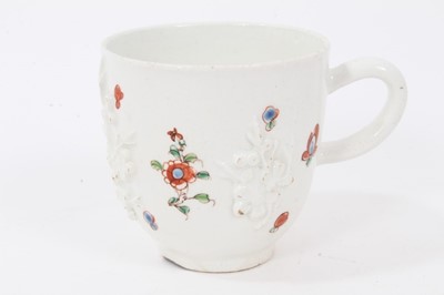 Lot 157 - Bow coffee cup, with applied prunus decoration, painted in famille verte palette, circa 1750-52
