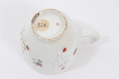 Lot 157 - Bow coffee cup, with applied prunus decoration, painted in famille verte palette, circa 1750-52