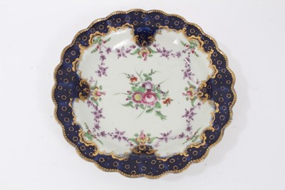 Lot 179 - Worcester plate, painted with flowers, 'Sèvres' style blue and gilt border, circa 1772