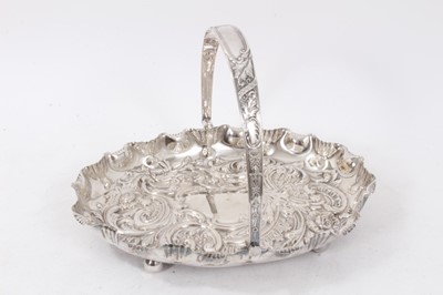Lot 395 - Edwardian silver swing handled dish of oval form, with shaped shell border