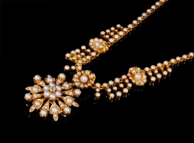 Lot 469 - Victorian gold seed pearl and diamond pendant necklace with detachable pendant/brooch, the star shape flower with a central old cut diamond, suspended from a gold and seed pearl fringe necklace wit...