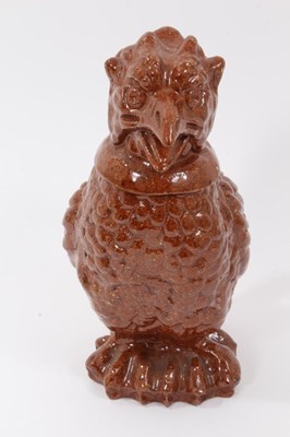 Lot 186 - Unusual treacle glazed pottery jug in the form of a bird, 25cm high