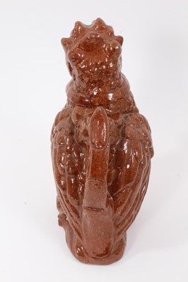Lot 136 - Unusual treacle glazed pottery jug in the form of a bird, 25cm high