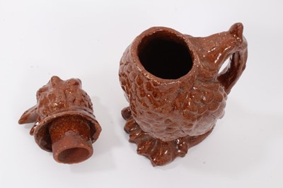 Lot 186 - Unusual treacle glazed pottery jug in the form of a bird, 25cm high