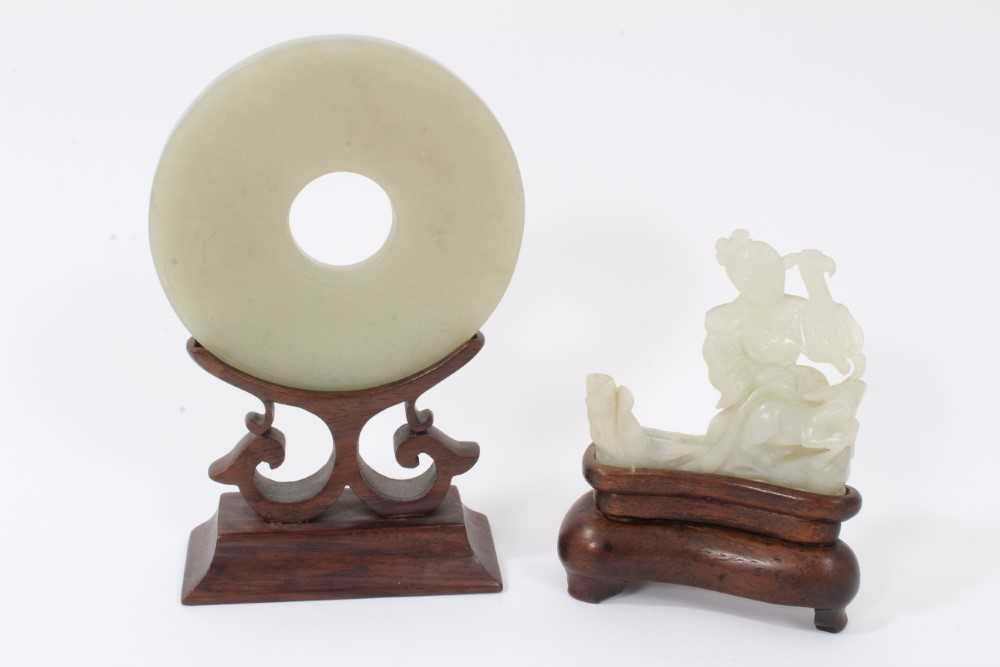 Lot 784 - Good Chinese carved jade figure, together with a carved jade bi-disc